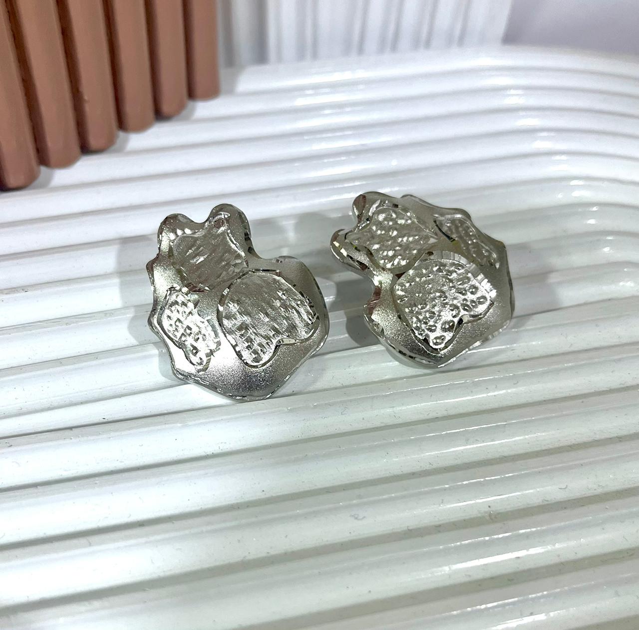 Shimmering Teddy Silver Studs.